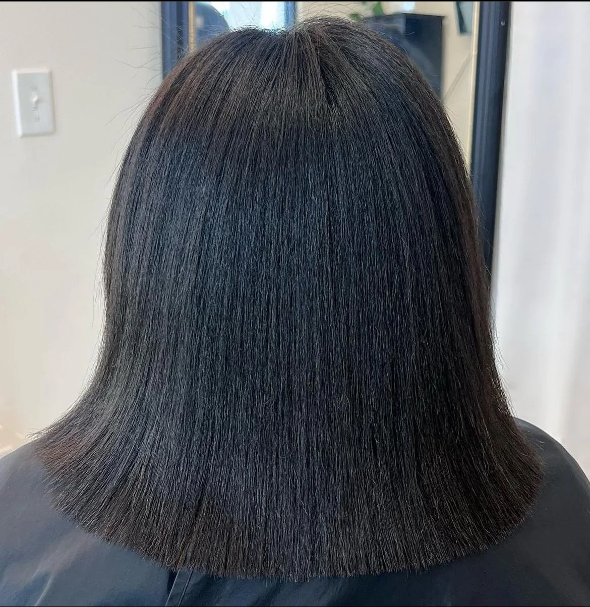Flat iron sleek silk press & precision trim on textured hair in Dallas, Texas.